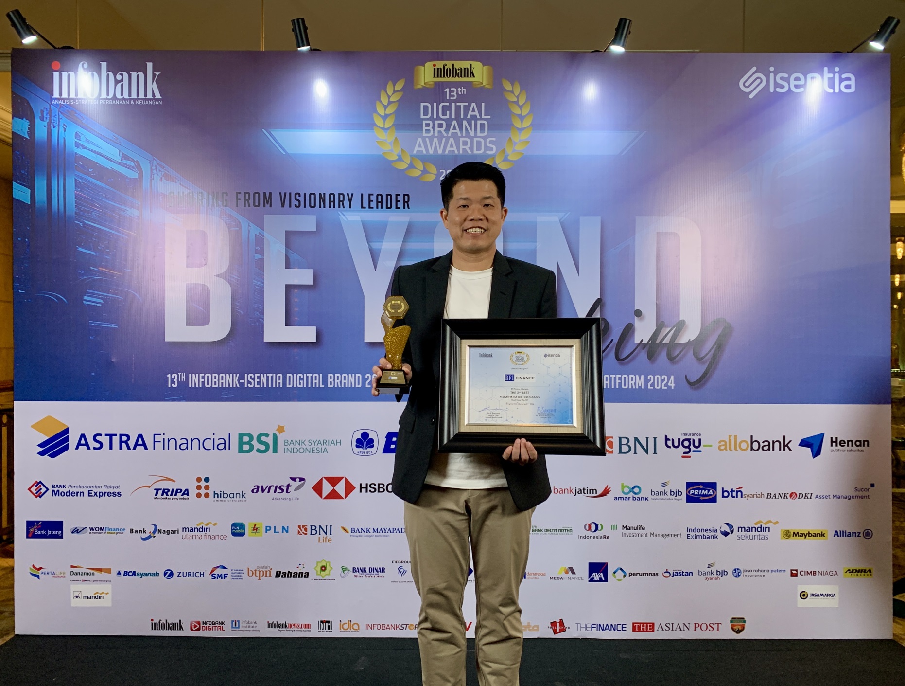 Kardiawan, Digital Marketing & Communication Head, represents the company to receive the awards